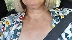 Naughty housewife takes homemade selfie with exposed tits in the car.