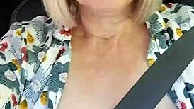 Naughty housewife takes homemade selfie with exposed tits in the car.