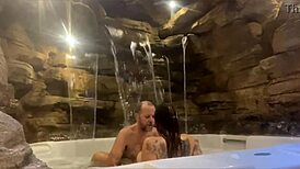 Couple enjoying honeymoon in motel, wife relaxing by the pool with a fun ride.