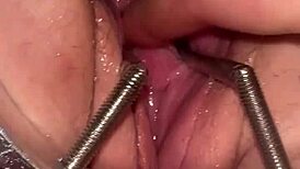 fist queen's pussy stretched with metal ring