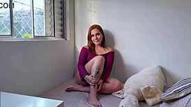 Redhead teen shows natural tits in solo dirty talk.