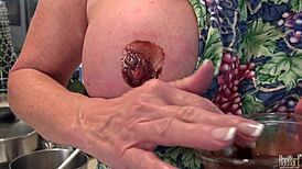 Mature housewife Raehart experiences pure pleasure in the kitchen, showcasing her big tits in uniform while engaging in intimate acts