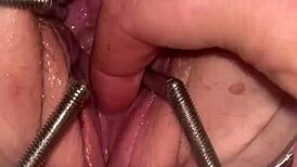 fist queen's pussy stretched with metal ring