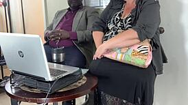 horny milf secretary blows black cock in office