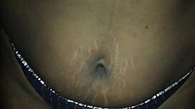 I indulge in erotic masturbation as a mature black milf, fingering myself sensually.