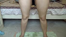 Beautiful woman urinates gracefully on the floor