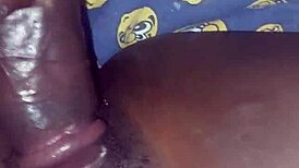 Teasing her hairy beaver with a monster black cock before penetration