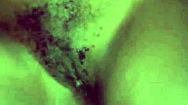 Teasing her hairy beaver with a monster black cock before penetration