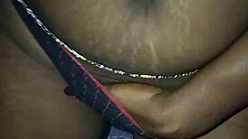 I indulge in erotic masturbation as a mature black milf, fingering myself sensually.