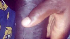 Teasing her hairy beaver with a monster black cock before penetration