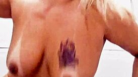 milf in bathroom slides dildo into shaved pussy