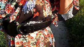 Hairy mature woman wears transparent dress outdoors