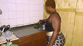 Irie and his wife in local kitchen while washing