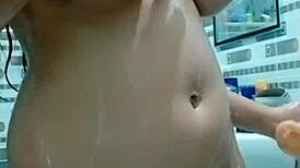 Pakistani stepmom slips dildo into her ass in the bathroom, moaning with error-filled pleasure