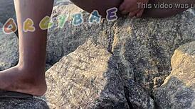 Couple having fun playing voyeur at the public bar and beach