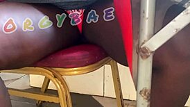 Couple having fun playing voyeur at the public bar and beach