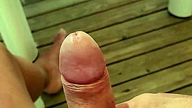 Solo guy masturbates monster cock near orgasm on terrace
