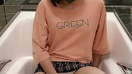 shemale ting xuan bathes in the bathtub while clothed