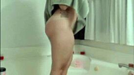 The chubby teen with a tight ass bathes in the shower on webcam.