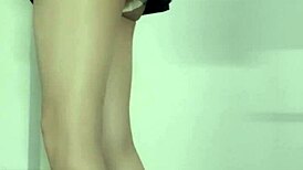 Asian ladyboy masturbates outdoors in public, cum soaking her panties under the skirt.