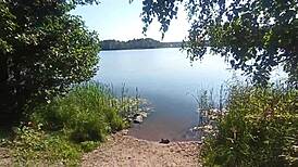 Couple Enjoys Outdoor Time By The Lake