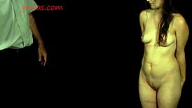 Amateur shy girl endures whipping punishment in garage