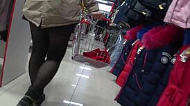 A hidden camera in a fitting room admires a juicy pawg and peeping for legs in a public mall voyeur fetishist