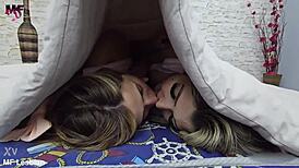 Sultry young student blondes engage in intense wet kissing in bedroom