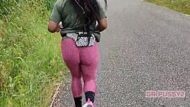 Ebony Woman with Large Butt in Leggings Running Alone in the Forest