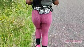 Ebony Woman with Large Butt in Leggings Running Alone in the Forest