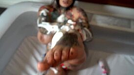 Sabien Demonia enjoys some anal play in the bath tub.