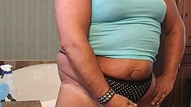 darcy cums at home, her suggestive actions hinting at deeper pleasures and intimate moments.