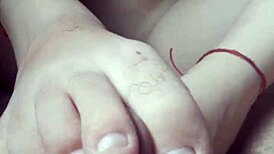 Petite girl gives footjob while masturbating passionately!