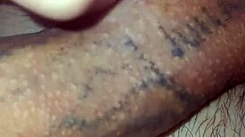 Detailed solo masturbation showcasing massive pierced cock with multiple holes