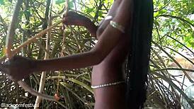 Naked Skinny Tribe Woman Making A Bow To Go Hunting