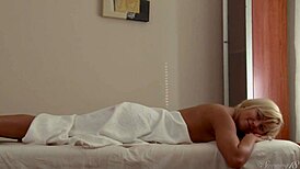 a big-dicked masseur is massaging blonde mya l's wet pussy on all fours, making her moan loudly