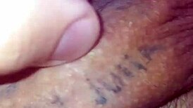 Detailed solo masturbation showcasing massive pierced cock with multiple holes