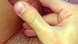 Detailed solo masturbation showcasing massive pierced cock with multiple holes