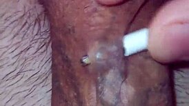 Detailed solo masturbation showcasing massive pierced cock with multiple holes