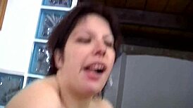 This brunette slut fingers her pussy with a dildo while watching porn