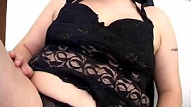 This brunette slut fingers her pussy with a dildo while watching porn