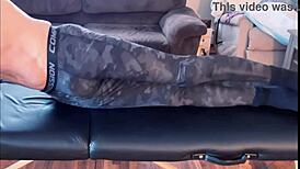 Stretching in compression pants on massage table