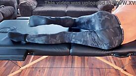 Stretching in compression pants on massage table