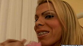 i'm a busty blonde shemale hottie yanking my thick cock so hard it throbs