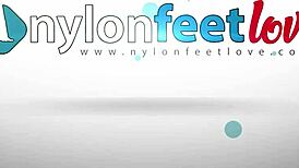 sexy redhead teases in black pantyhose revealing perfect ass and nylon feet