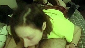 redhead slave deepthroats intensely on stomach