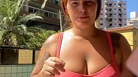 swollen pussy flashes bold on live as curvy redhead spreads wide for exhibitionist thrill