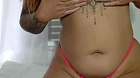 her swollen pussy stretches the tiny bikini in solo flashing tease