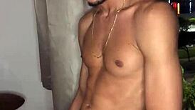 Safado teen jerks huge load while peeking out building window.