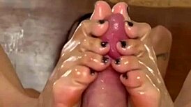 check out this latina whore getting her oily feet stroking monster cock